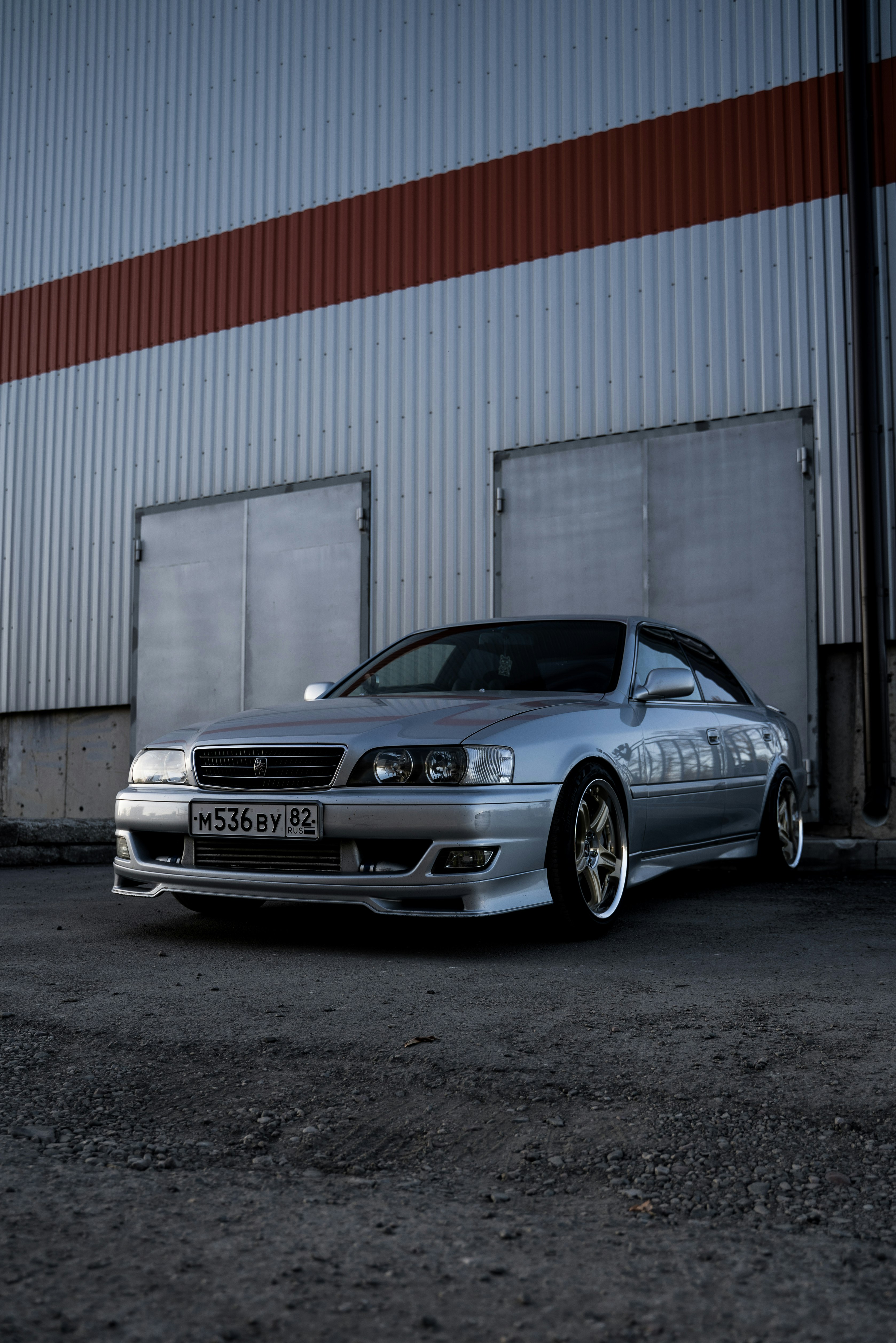 black bmw m 3 coupe parked beside white wall